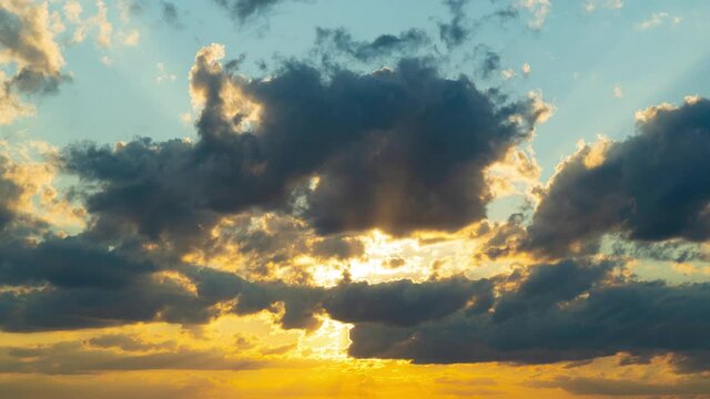 Clouds fly across the sky at sunset. Timelapse