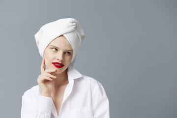 pretty woman white shirt cosmetics with towel on head studio model unaltered