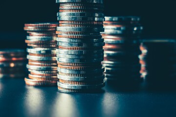 Pile of gold coins stack in finance treasury deposit bank account for saving . Concept of corporate...