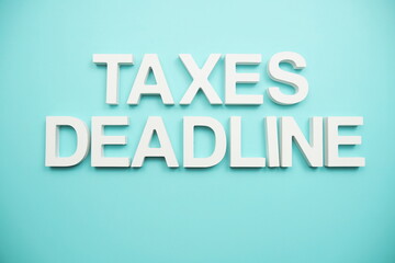 Taxes Deadline alphabet letters on blue background