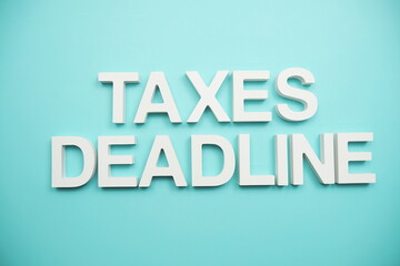 Taxes Deadline alphabet letters on blue background