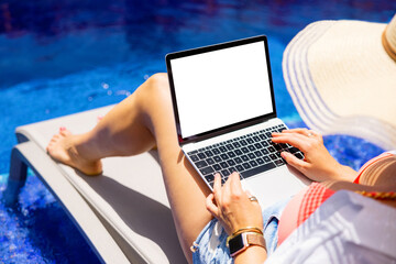 Woman working with laptop computer by the pool, screen mockup