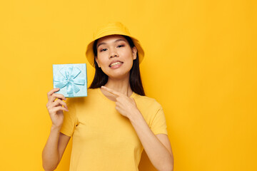 woman with a gift box in his hands surprise emotions studio model unaltered 