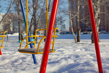 Swing on winter background.