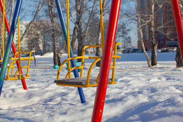 Swing on winter background.