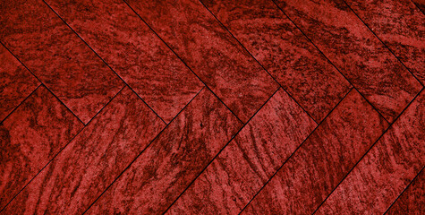 luxury herring bone patterned stone n close up view. red fantasy concrete or cement flooring pattern for walkway, sidewalk. pavement texture background in red color tone. abstract background.