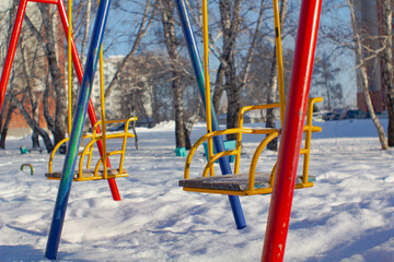 Swing on winter background.