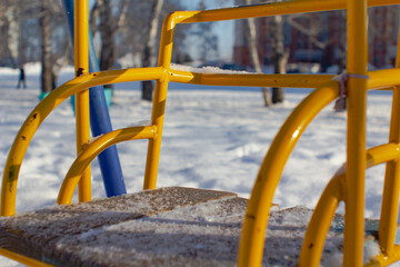 Swing on winter background.