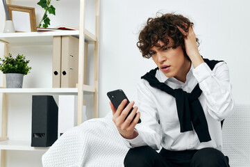 blogger in the room on the couch with the phone online learning living room