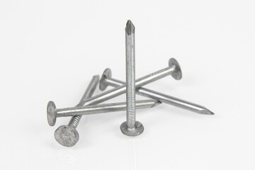 Metal construction nails on a white background.