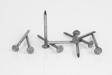 Metal construction nails on a white background.