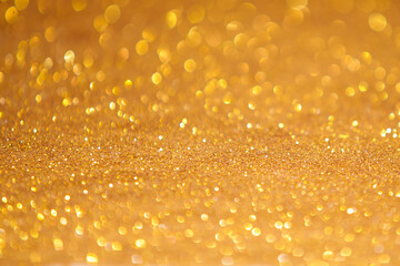 Bokeh light gold background.