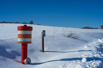 Fire hydrant in snowing landscape