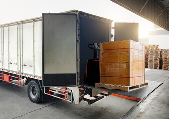 Cargo Truck Container Loading Packaging Boxes at Dock Warehouse. Slider Lift for Loading Truck....
