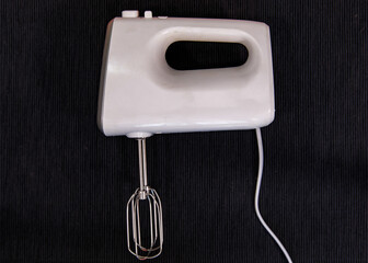 Close up studio photo of bakery equipment on black background .