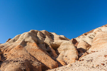 Scenery with red rock cliffs, and stone desert near Mojave, California in the west of the U.S. 