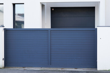 Aluminum door steel dark gray metal gate of house street portal of suburb access home