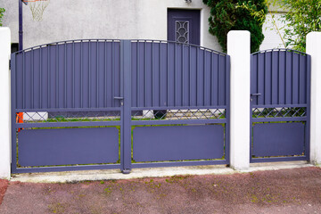 portal old grey classic metal home gate at entrance of house garden gray door