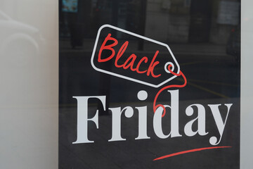 black friday text sign and design logo on store windows entrance for discount price