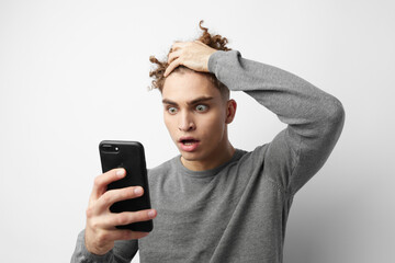 Fototapeta premium Attractive man with a phone in hand communication Lifestyle unaltered