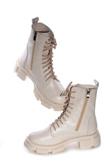 Fototapeta premium Female winter boots on high soles on a white background