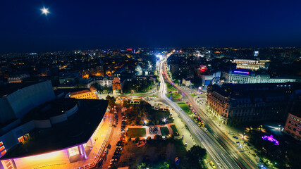 Fototapeta na wymiar Top view of Bucharest during summer evening. Bucharest from above with view to its main landmarks, night cityscape from Romania.
