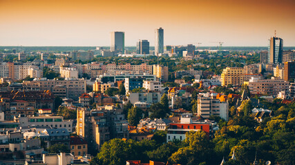 Obraz premium Bucharest view from above during summer sunrise. Landmarks of the capital city of Romania.
