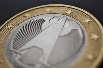 1 euro coin issued in Germany close-up. Focus on the head of the Federal Eagle. Economic background or backdrop. European Union currency. Eurozone economy news. Macro