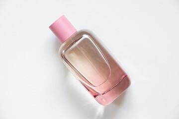 bottle with women's perfume on a white background, perfumed