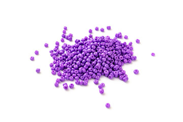 purple beads are scattered on a white surface. isolate. sale of accessories for creativity and needlework.