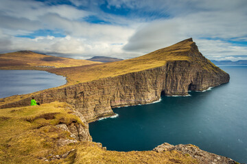 Tourists on the walking path Traelanipan Trail, Traelanipa, Faroe Islands.
