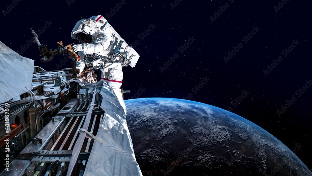 Wall mural astronaut spaceman do spacewalk while working for spaceflight mission at space station . astronaut w