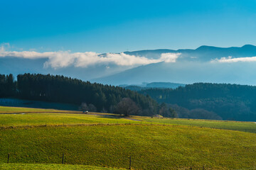 Germany, Black forest mountains panorama view above nature landscape foggy clouds in vale on sunny day in tourism hiking region