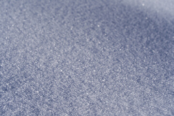 Close-up of beautiful curvy surface of snow layer in the Swiss Alps on a sunny winter day. Photo taken January 15th, 2022, Murren, Switzerland.