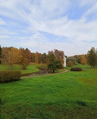 Fototapeta na wymiar A river in an ancient autumn park.