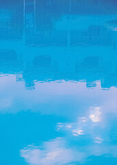 Obraz premium Minimalist wallpaper. Blue swimming pool relax water. Vacation dreams time concept