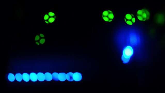 Blurred background of LED lights of server telecommunications equipment, abstract close-up