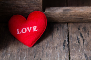 love message on red heart valentine decoration on wood