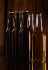 beer bottles on the background of a rough wooden wall