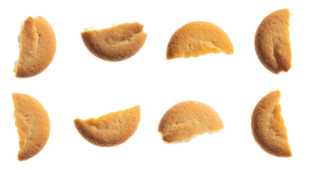 Assorted various forms of danish crumbly cookies isolated on white. Broken pieces. Shooting from above. 
