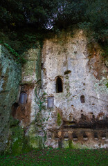 Fototapeta na wymiar Etruscan home with a small window.Building on the tuff