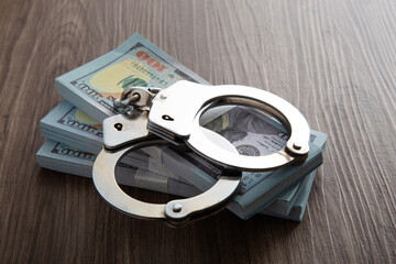 Concept for corruption, fraud and money laundry. Handcuff