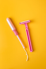 Women's hygiene products. Razor, vaginal tampon.