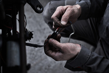 Car service worker repairs restores car