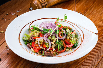 German food salad from boiled veal, vegetables and onion