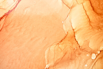 Abstract ocher ink watercolor background. Yellow orange brown paint stains and spots in water,...