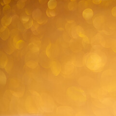 Bokeh light gold background.