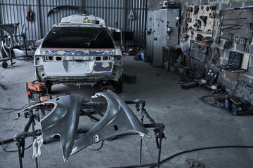 Repair of an old broken car at auto service