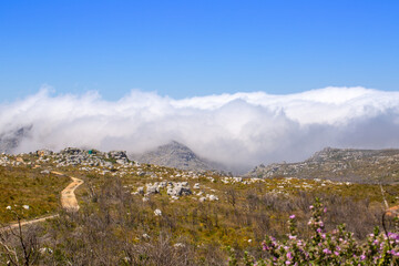 Clouds coming up over the mountains of the Silvermine Nature Reserve near Cape Town in the Western Cape of South Africa