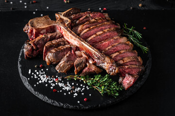 T-bone grilled beef steak. Dry Aged Barbecue Porterhouse Steak. Medium rare. American cuisine. Long banner format, top view